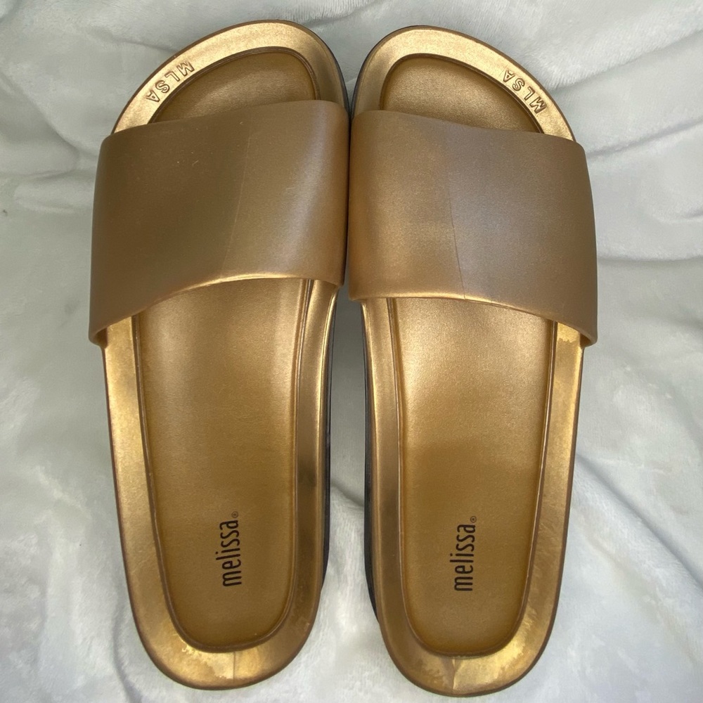 Melissa in gold size 10. Bough in the Soho store. Used 2 times last summer.